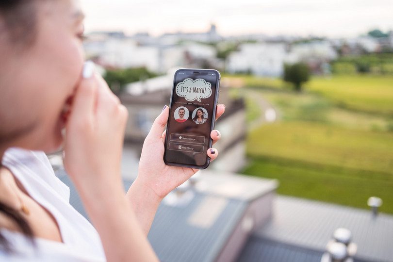 A woman makes a match on a dating app.